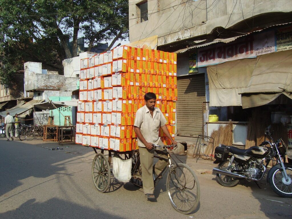 A cycle-rickshaw carrying shoe boxes in Agra
